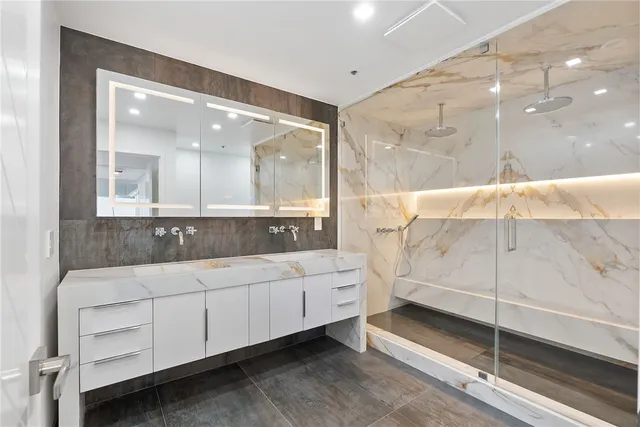 a view of a hallway with wooden floor and entryway