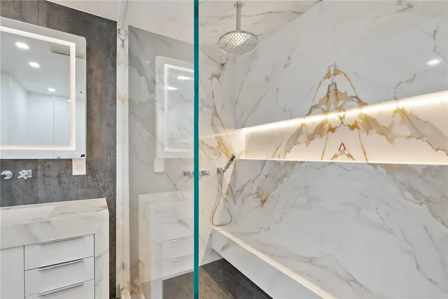 a kitchen with stainless steel appliances a sink and a refrigerator