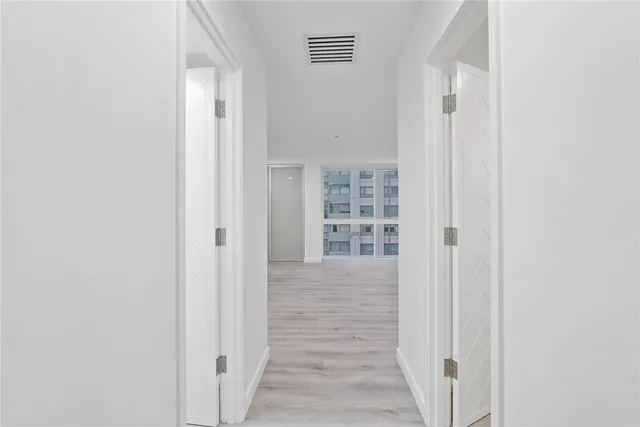 a kitchen with stainless steel appliances a sink and a refrigerator