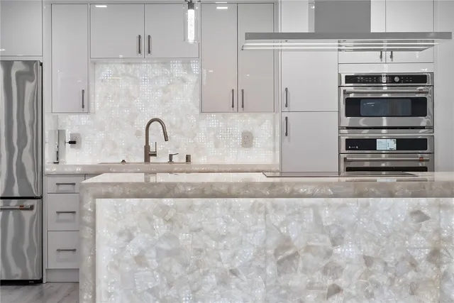 a bathroom with a glass shower door and a bathtub