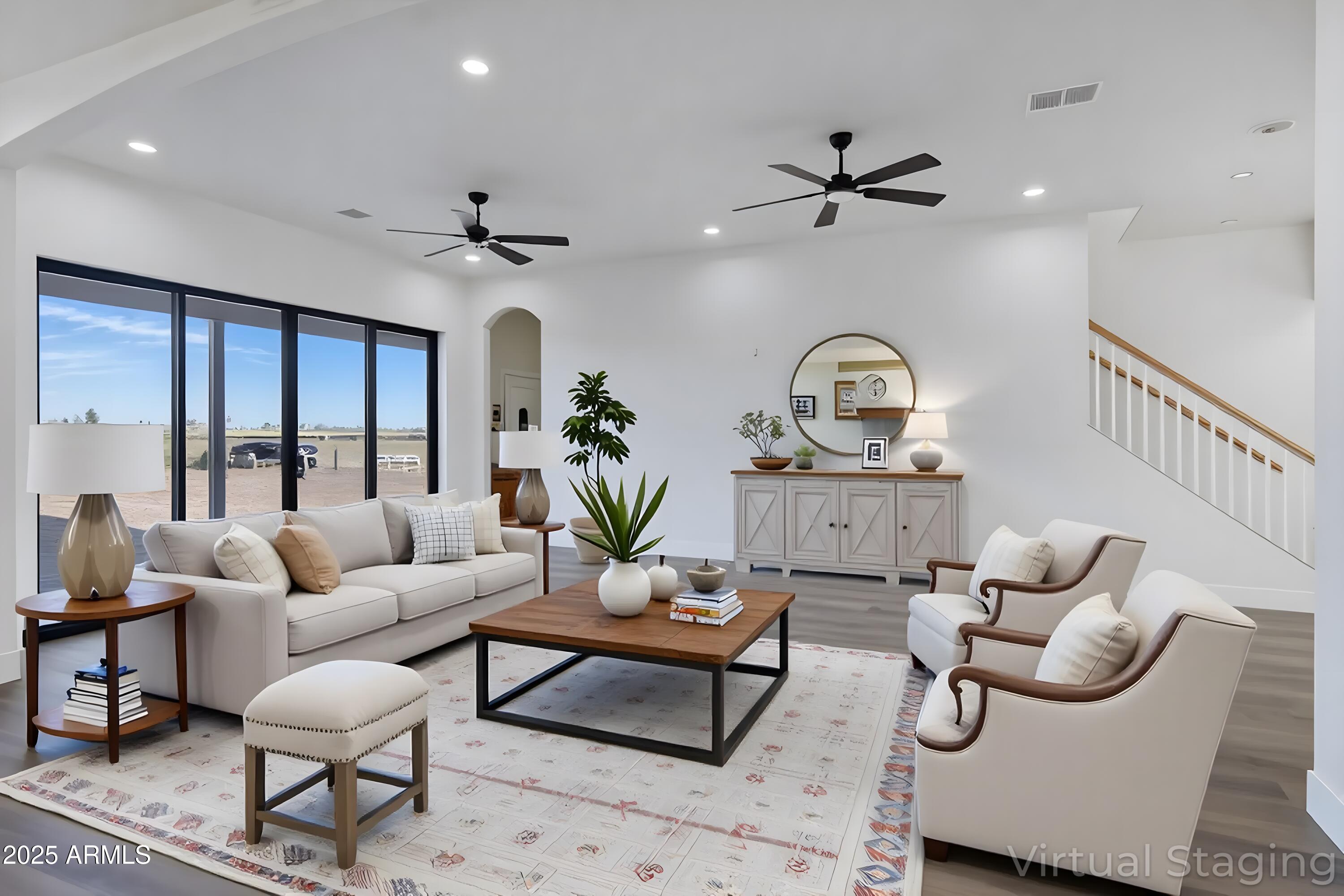 235 North Clemans Road Coolidge, AZ 85128 - Photo 11 of 33 a living room with furniture a chandelier fan and a rug