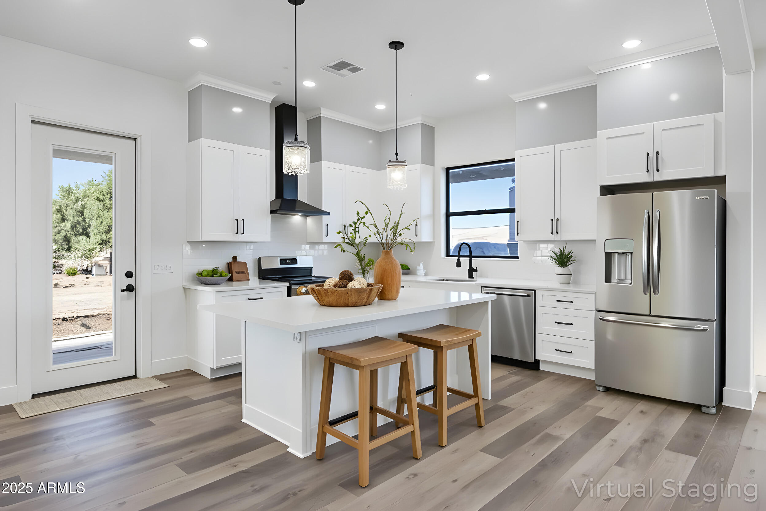 235 North Clemans Road Coolidge, AZ 85128 - Photo 12 of 33 a kitchen with white cabinets stainless steel appliances and kitchen island