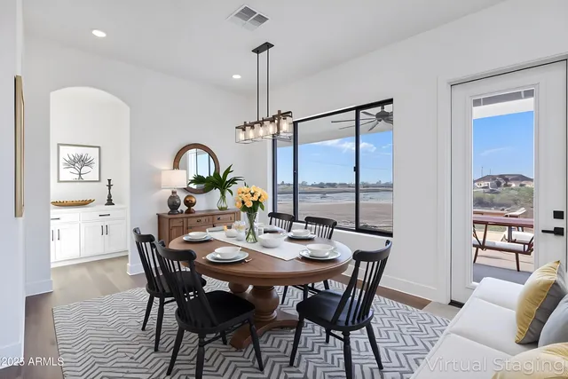 a kitchen with white cabinets stainless steel appliances and kitchen island