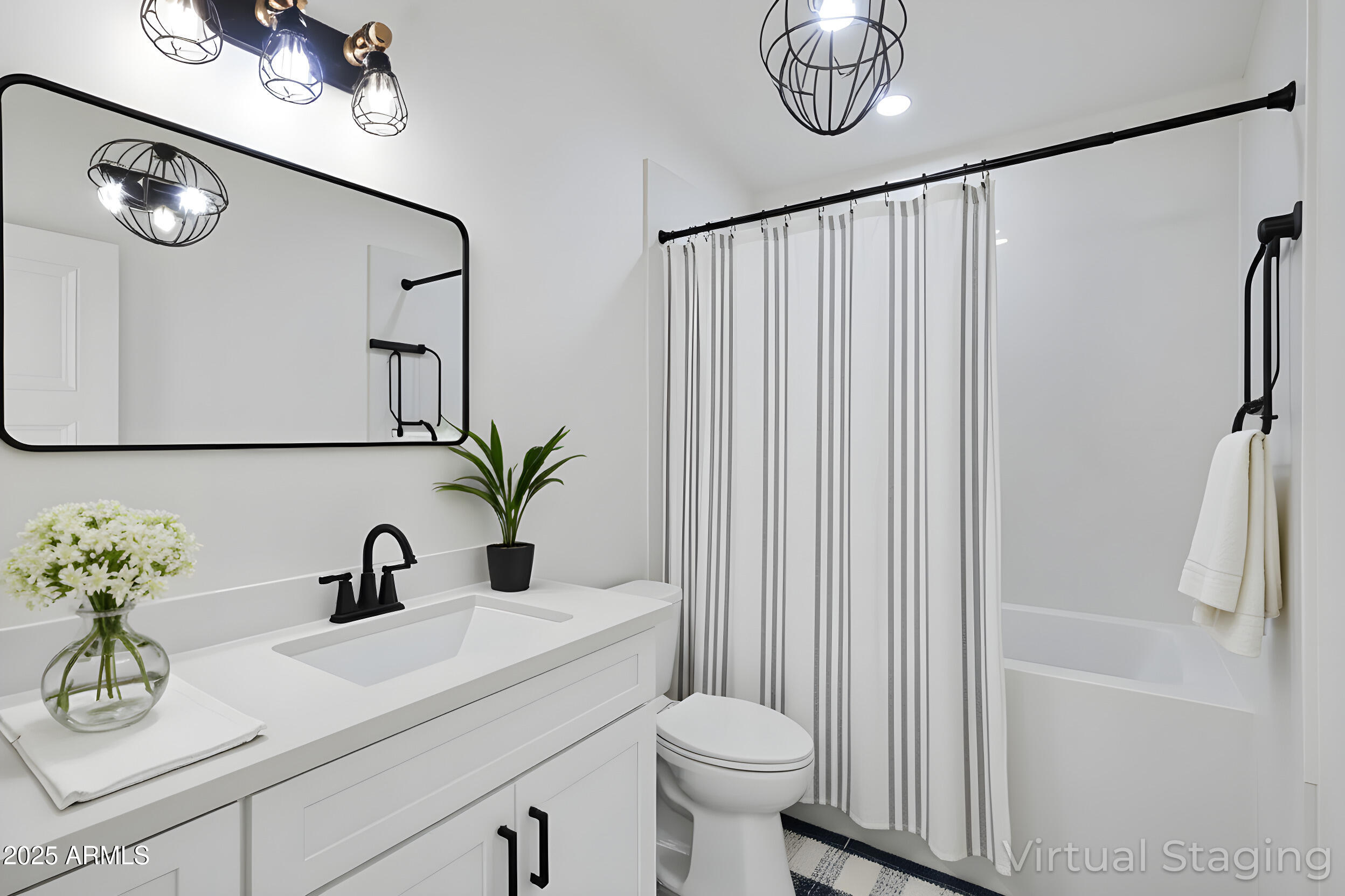 235 North Clemans Road Coolidge, AZ 85128 - Photo 20 of 33 a bathroom with a sink a toilet a mirror and shower