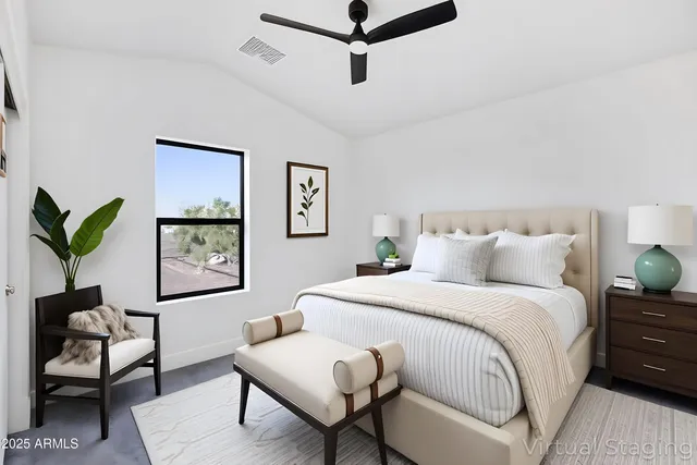 a bedroom with a bed and a desk