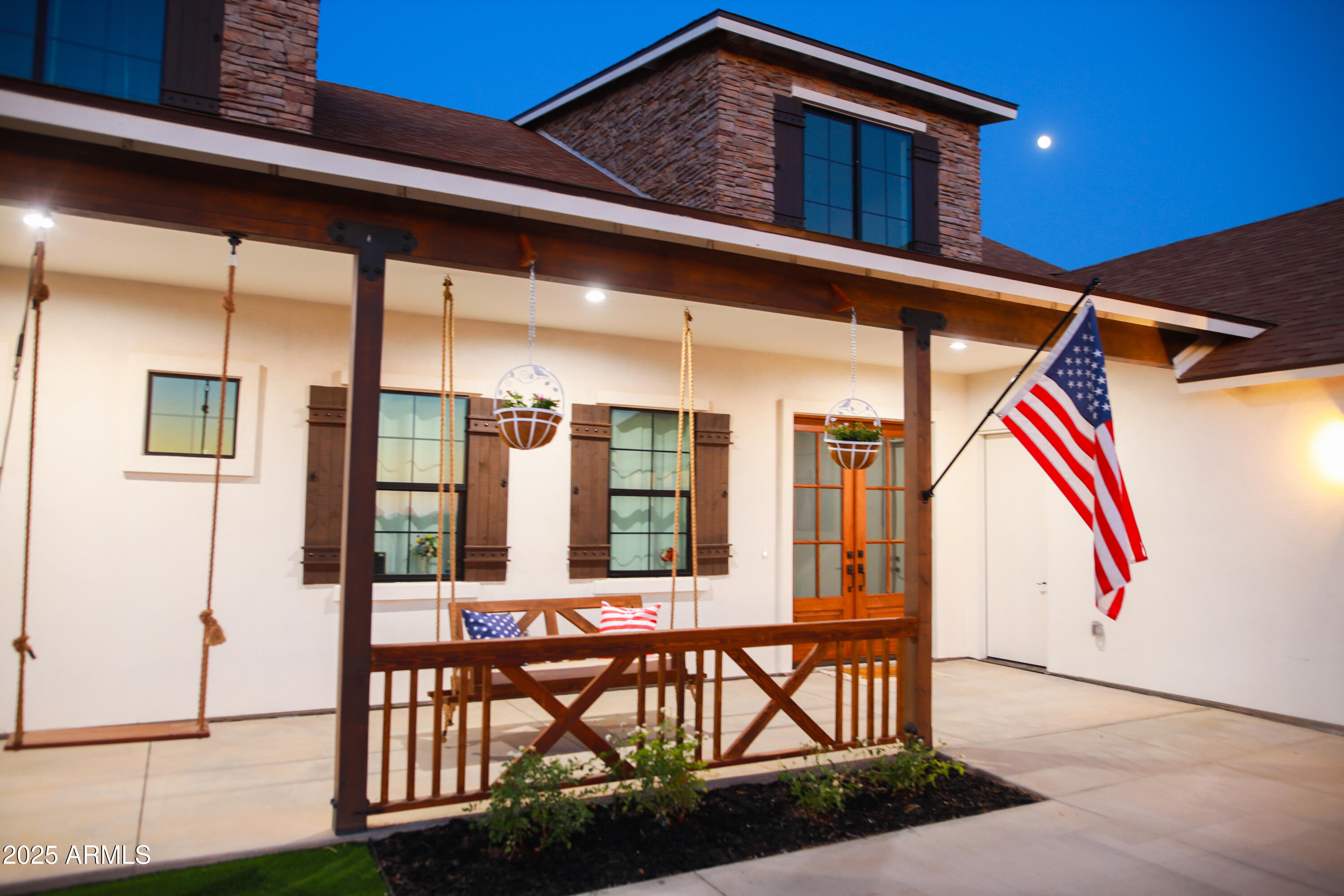 235 North Clemans Road Coolidge, AZ 85128 - Photo 6 of 33 a front view of a house with outdoor seating and wooden floor