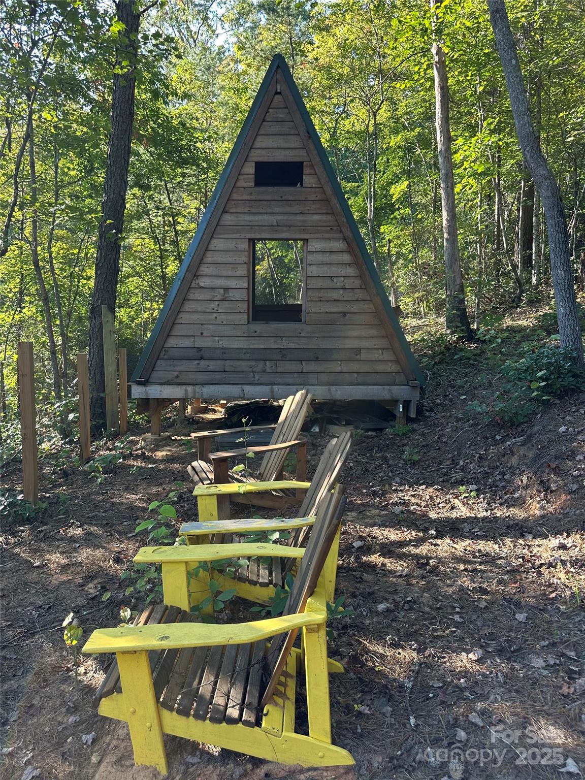 a view of backyard with deck and seating space