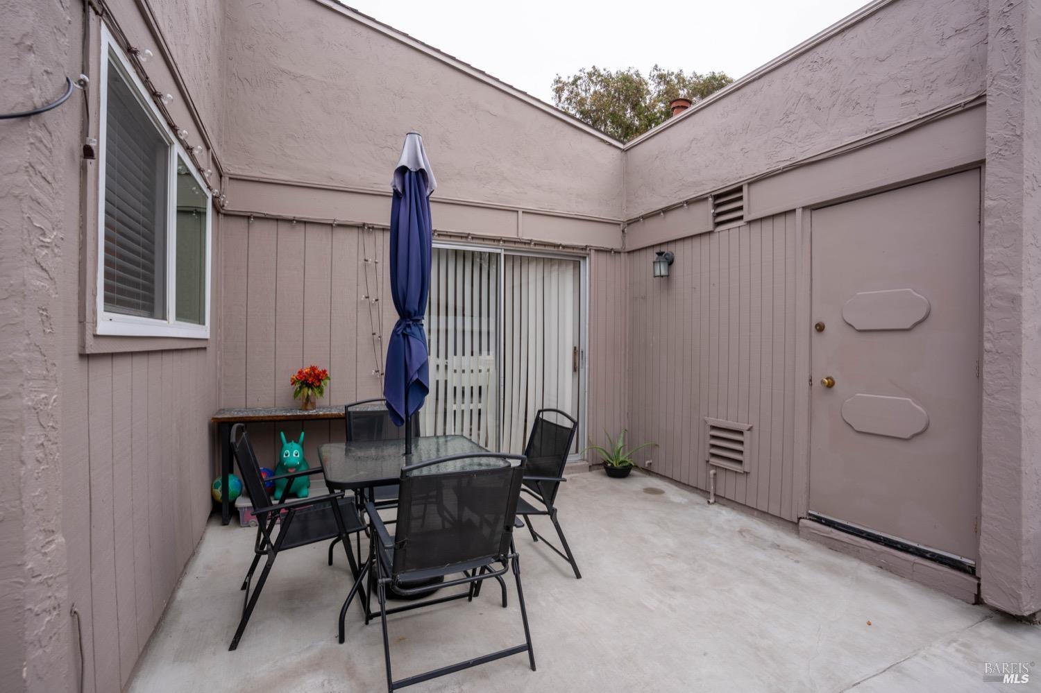 237 Del Loma Court Fairfield, CA 94533 - Photo 13 of 15 a view of an outdoor space with a glass door and chair