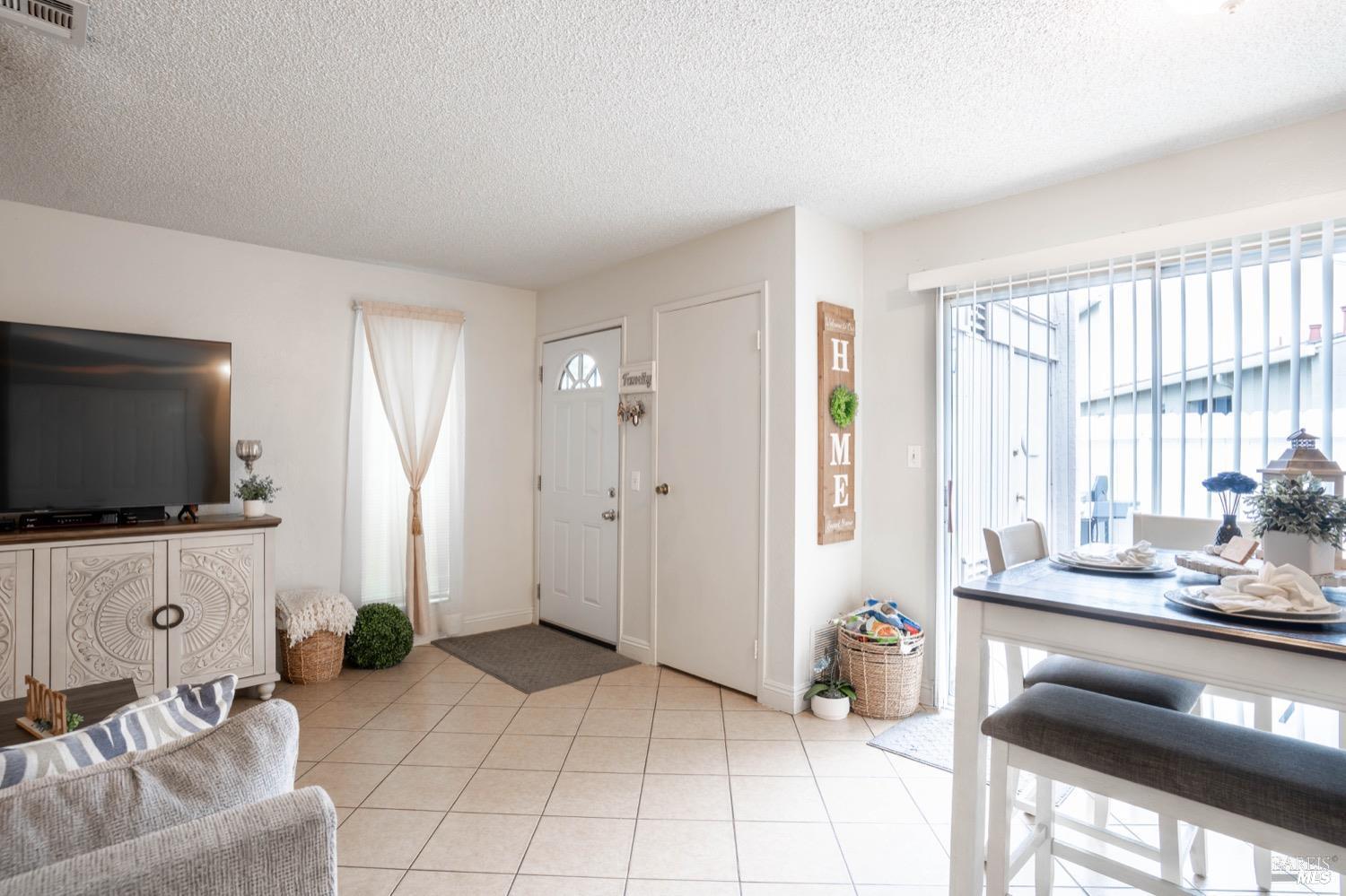 237 Del Loma Court Fairfield, CA 94533 - Photo 3 of 15 a living room with furniture and a flat screen tv