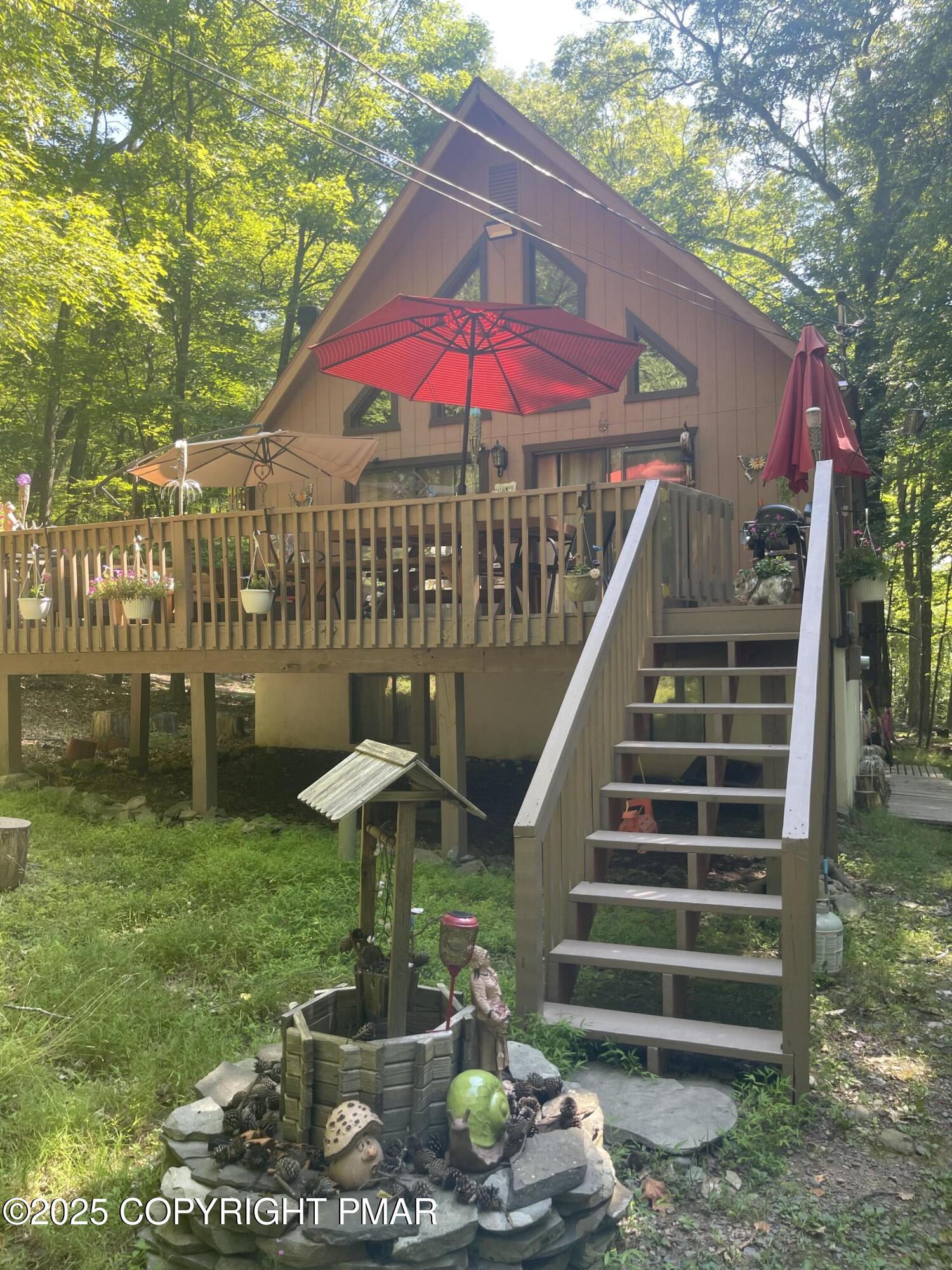 2112 Eagle Path Bushkill, PA 18324 - Photo 1 of 14 a view of a patio with table and chairs potted plants