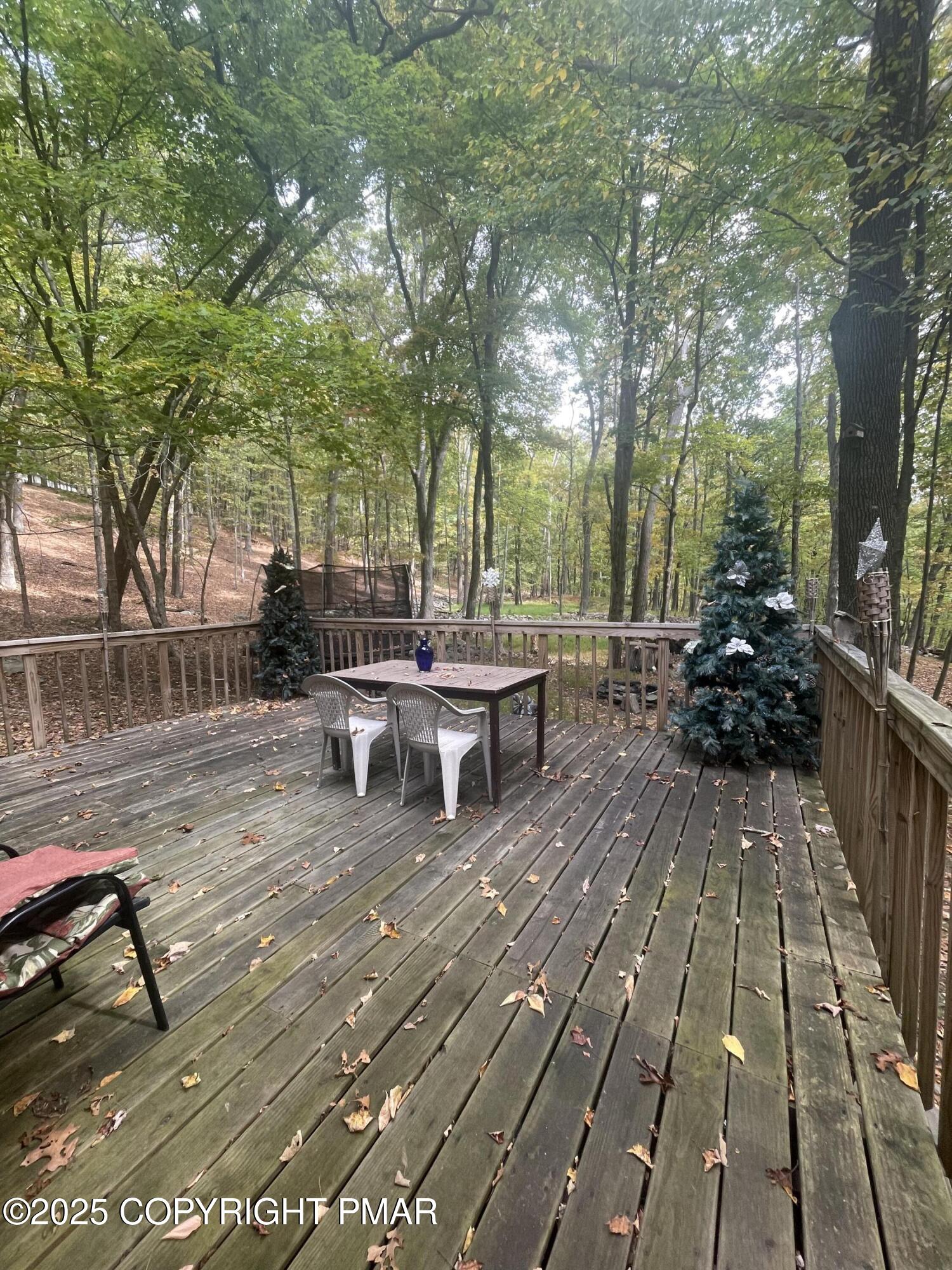 2112 Eagle Path Bushkill, PA 18324 - Photo 14 of 14 a view of a patio with table and chairs wooden floor and fence