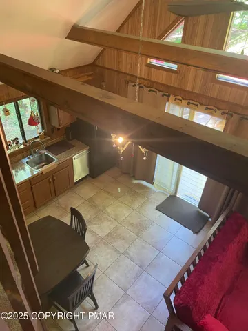 a view of living room with furniture and rug