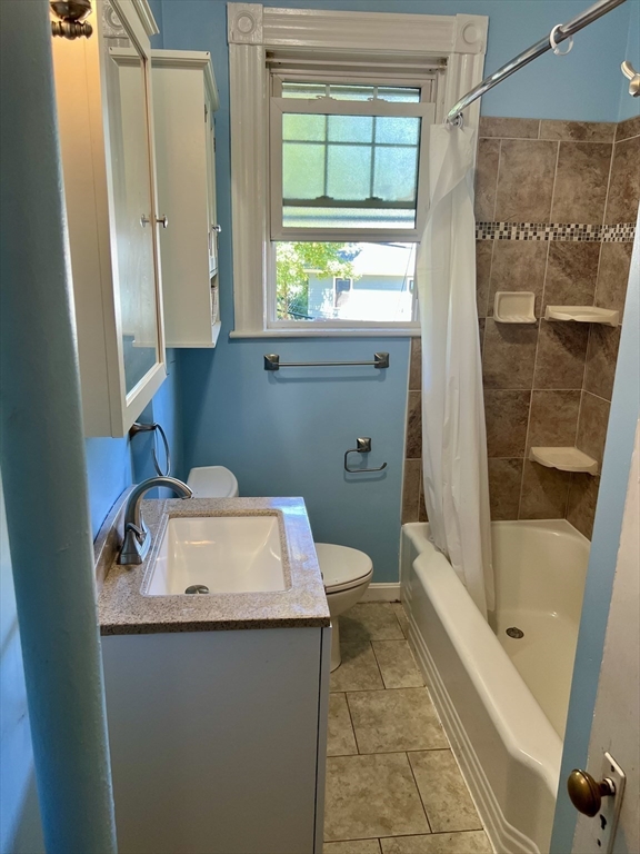 765 Boylston Street, Unit 1 Brookline, MA 02467 - Photo 4 of 12 a bathroom with a sink toilet and shower