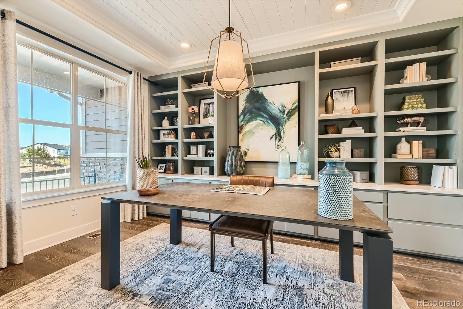 14163 Kearney Loop Thornton, CO 80602 - Photo 11 of 35 a view of a workspace with furniture