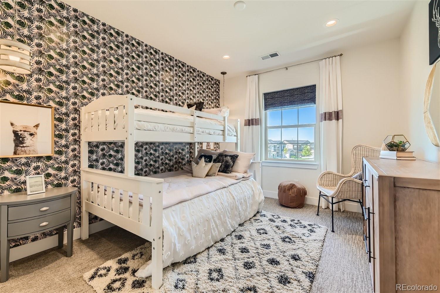 14163 Kearney Loop Thornton, CO 80602 - Photo 18 of 35 a bedroom with a bed and a window