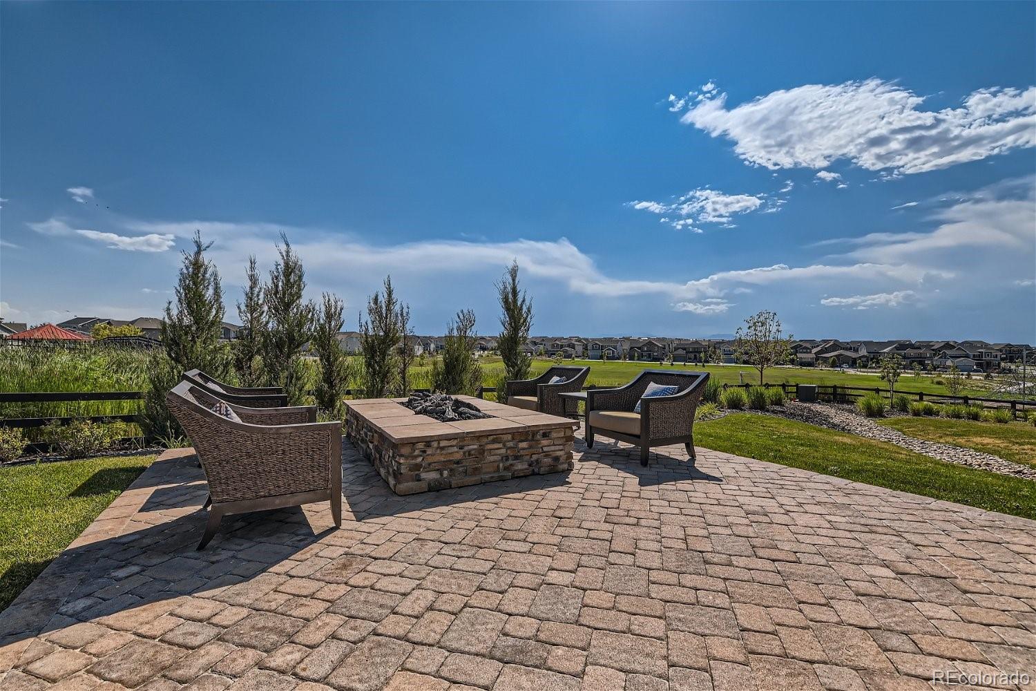 14163 Kearney Loop Thornton, CO 80602 - Photo 26 of 35 a view of a patio with a table and chairs