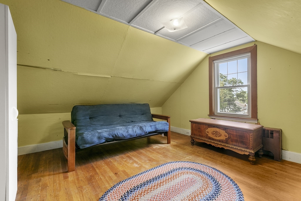 43 Long Meadow Road Arlington, MA 02474 - Photo 20 of 42 a bedroom with a bed and a dresser next to a window