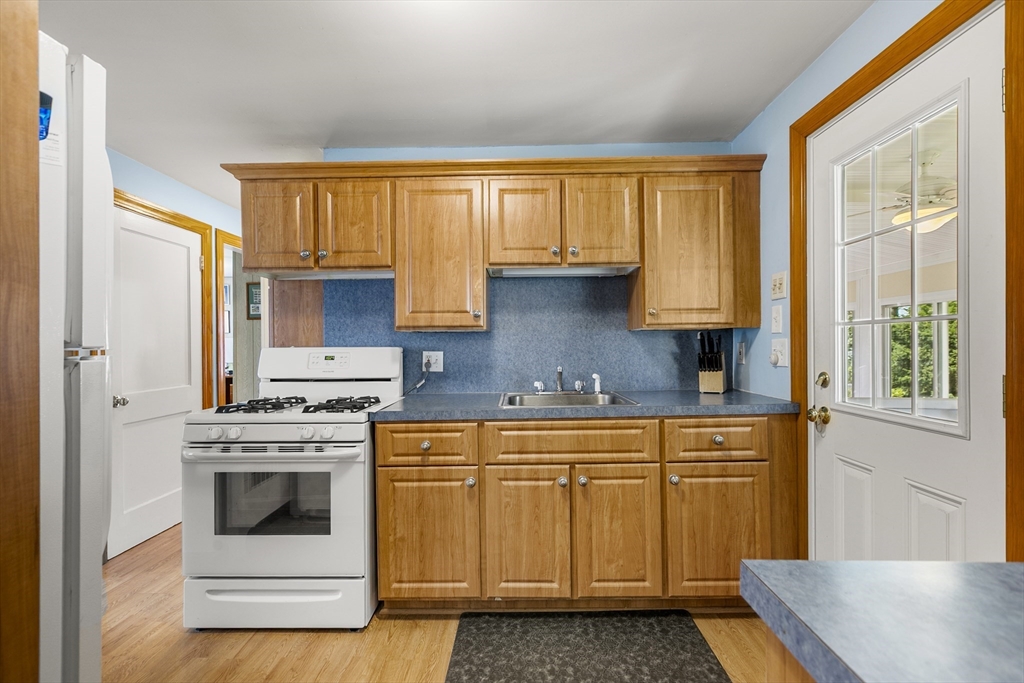 43 Long Meadow Road Arlington, MA 02474 - Photo 8 of 42 a kitchen with a stove a sink and a microwave