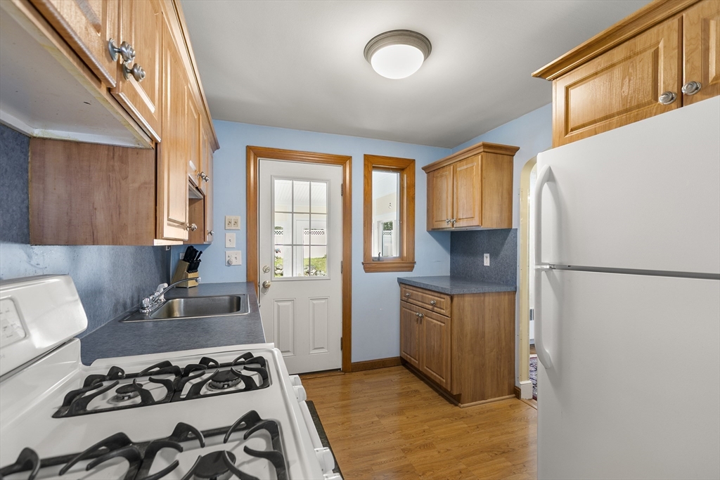 43 Long Meadow Road Arlington, MA 02474 - Photo 9 of 42 a kitchen with a stove a refrigerator and a stove