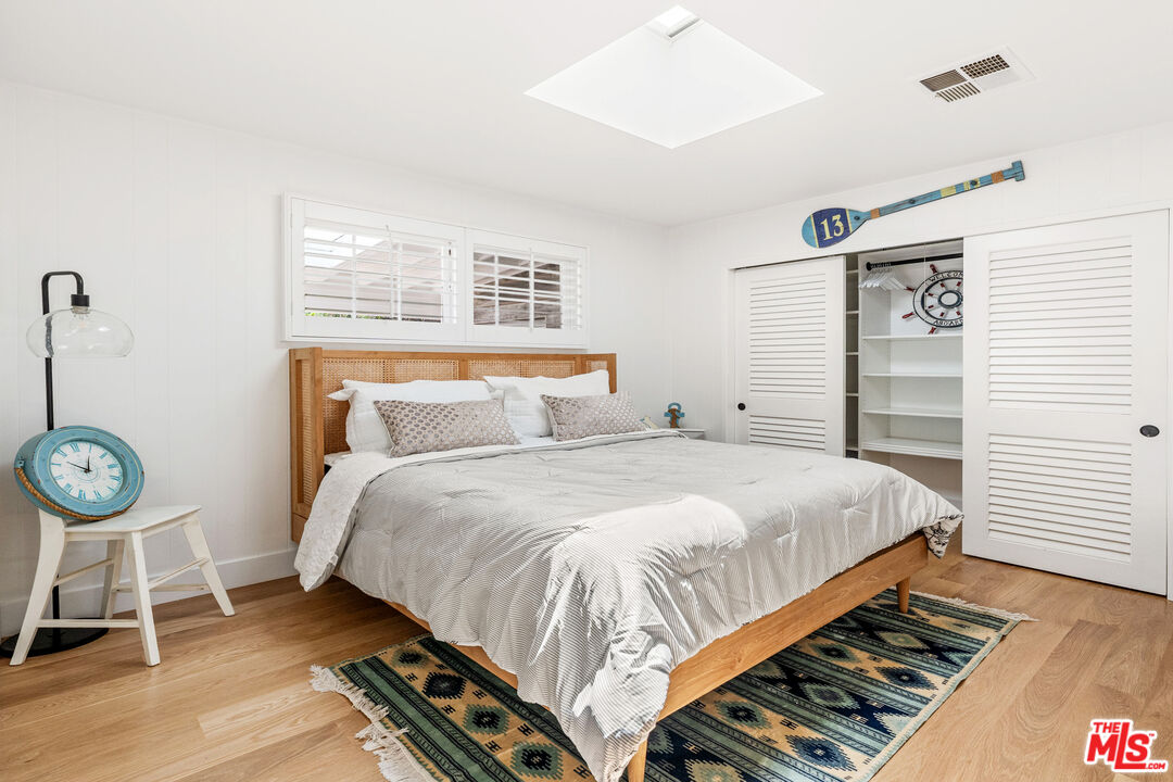 29500 Heathercliff Road, Unit 173 Malibu, CA 90265 - Photo 13 of 27 a bedroom with a bed and a window