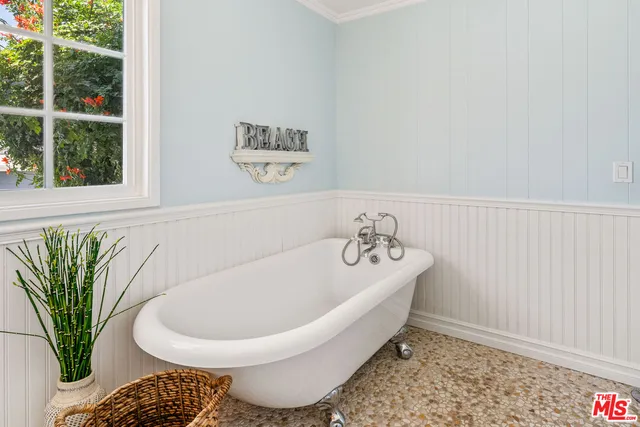 a bath tub sitting next to a white sink