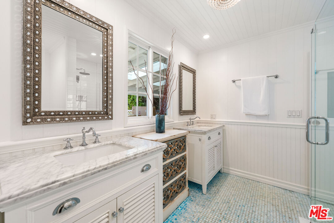 29500 Heathercliff Road, Unit 173 Malibu, CA 90265 - Photo 9 of 27 a spacious bathroom with a granite countertop sink mirror and double