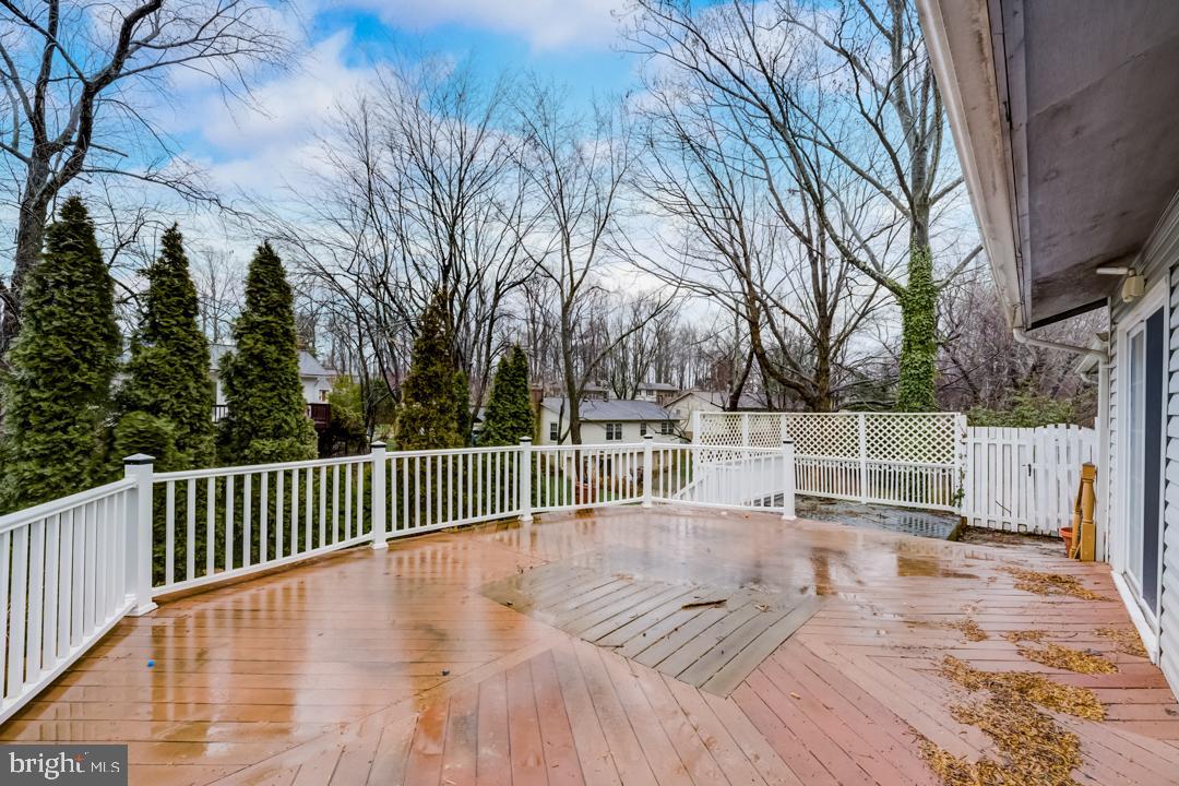7215 Willow Oak Place Springfield, VA 22153 - Photo 11 of 30 a deck view with wooden floor and fence next to a yard