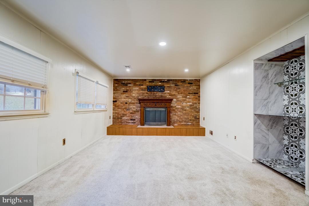 7215 Willow Oak Place Springfield, VA 22153 - Photo 19 of 30 a view of an empty room with a fireplace