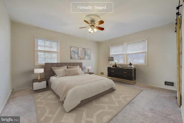 7215 Willow Oak Place Springfield, VA 22153 - Photo 2 of 30 a spacious bedroom with a bed and dresser