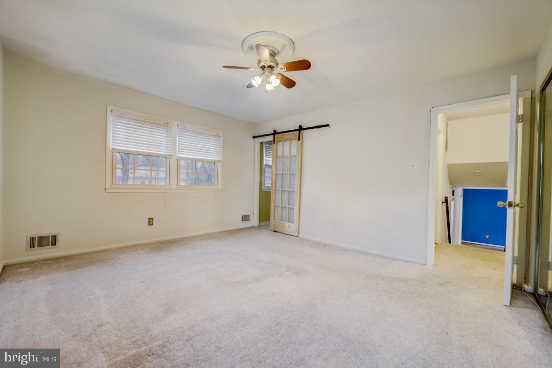 7215 Willow Oak Place Springfield, VA 22153 - Photo 27 of 30 a view of an empty room with a window