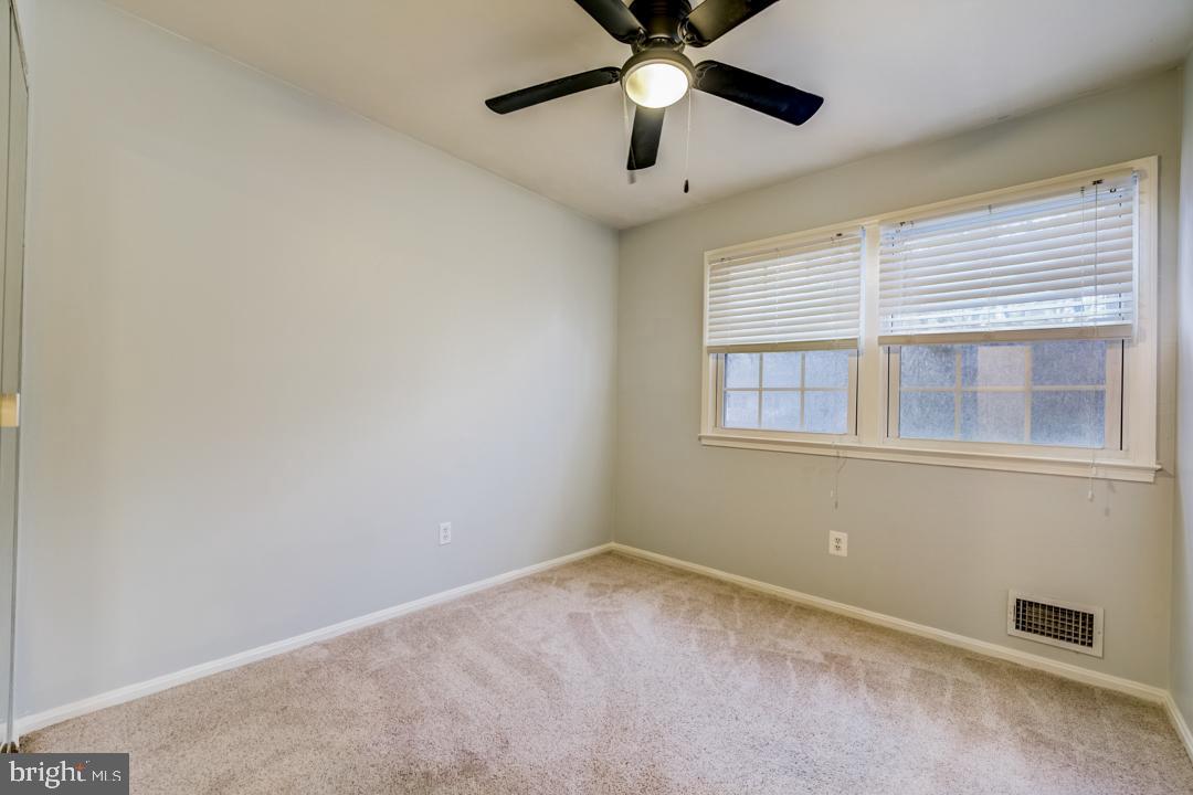 7215 Willow Oak Place Springfield, VA 22153 - Photo 29 of 30 an empty room with a window and a fan