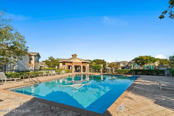 a view of a patio with swimming pool