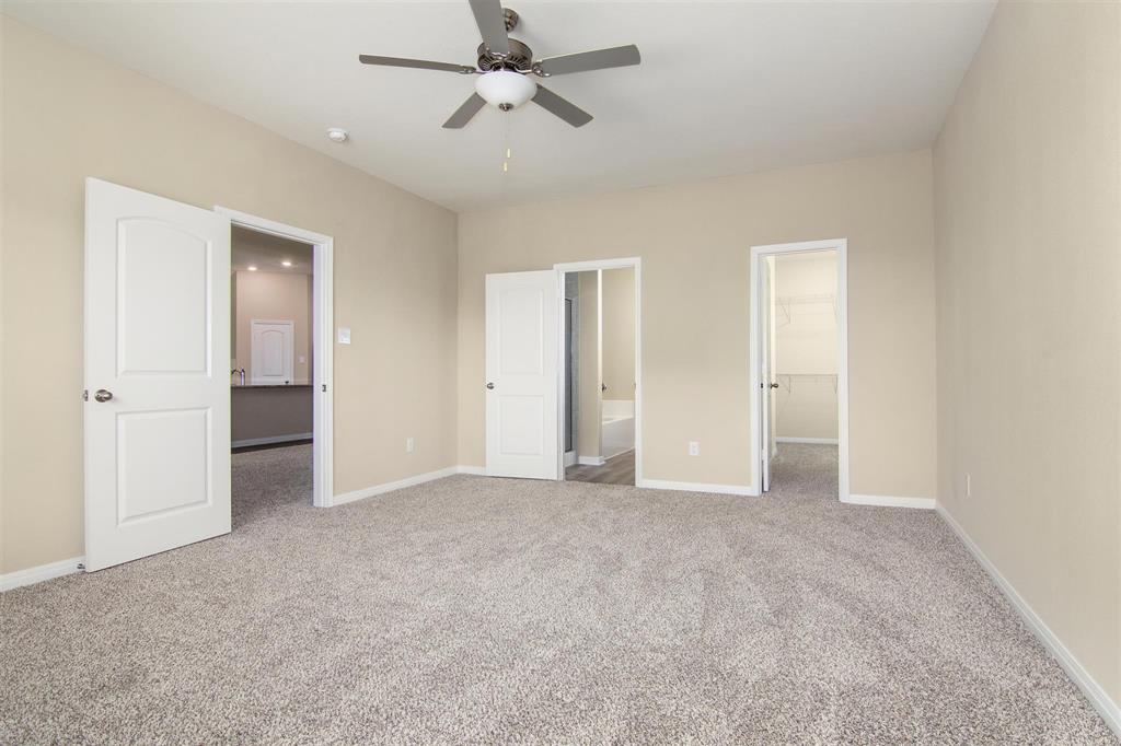 248 Enchanted Way Princeton, TX 75407 - Photo 10 of 24 an empty room with closet and a ceiling fan