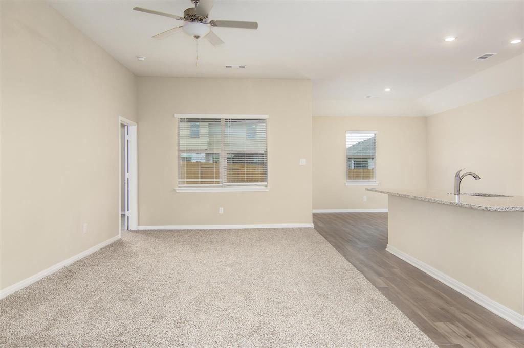 248 Enchanted Way Princeton, TX 75407 - Photo 13 of 24 a view of an empty room with a window