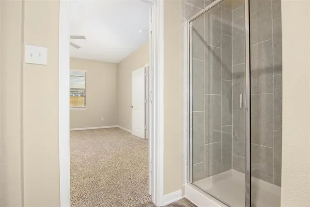 a view of an empty room with a window