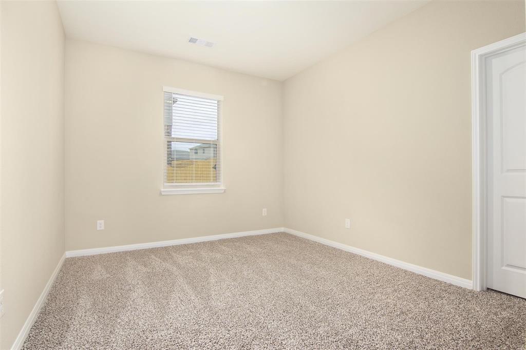 248 Enchanted Way Princeton, TX 75407 - Photo 16 of 24 an empty room with a window