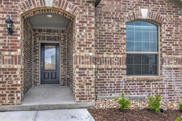 a front view of a house with a garage