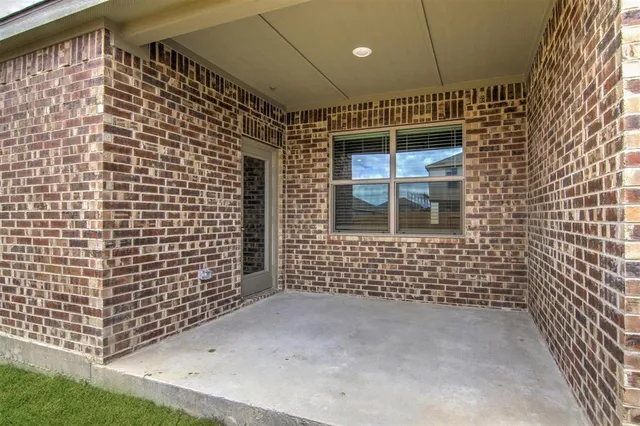 a kitchen with stainless steel appliances granite countertop a sink refrigerator and microwave