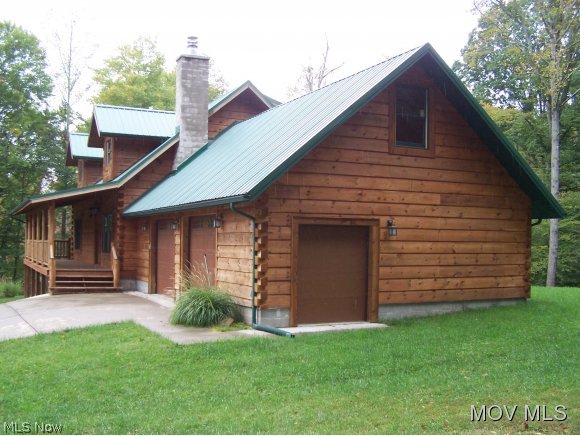 3067 Munday Road Elizabeth, WV 26143 - Photo 2 of 23 Side view of garage & house