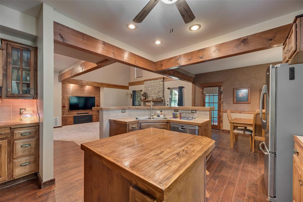 82 Trail Ridge Drive Melissa, TX 75454 - Photo 8 of 29 Large kitchen with butcher block island and tile countertops