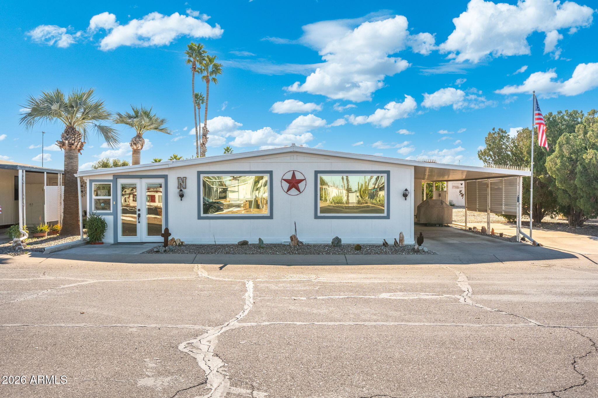 2100 North Trekell Road, Unit 196 Casa Grande, AZ 85122 - Photo 1 of 40 a view of a house with a yard and garage