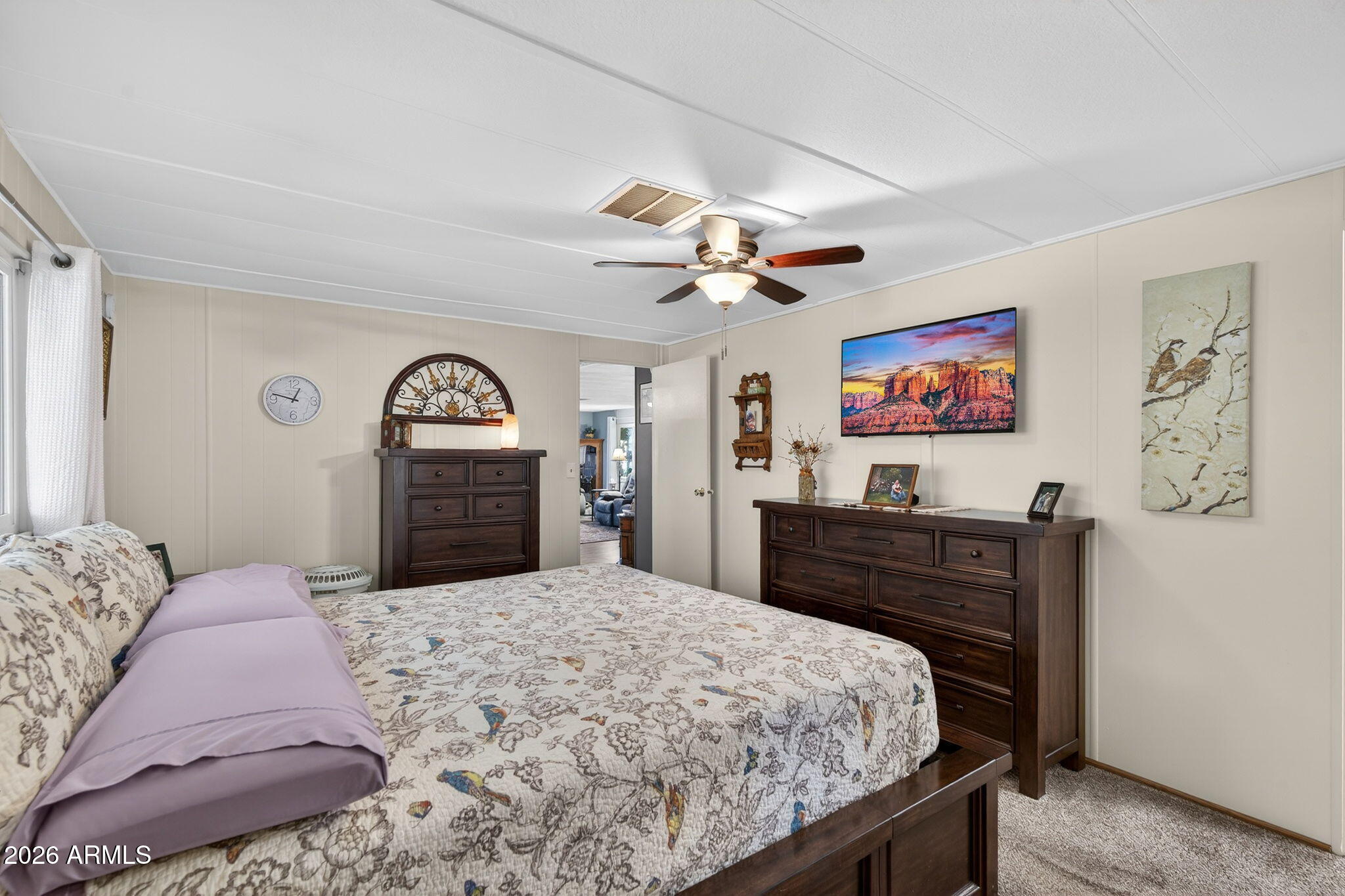 2100 North Trekell Road, Unit 196 Casa Grande, AZ 85122 - Photo 19 of 40 a bed room with a bed and a chandelier