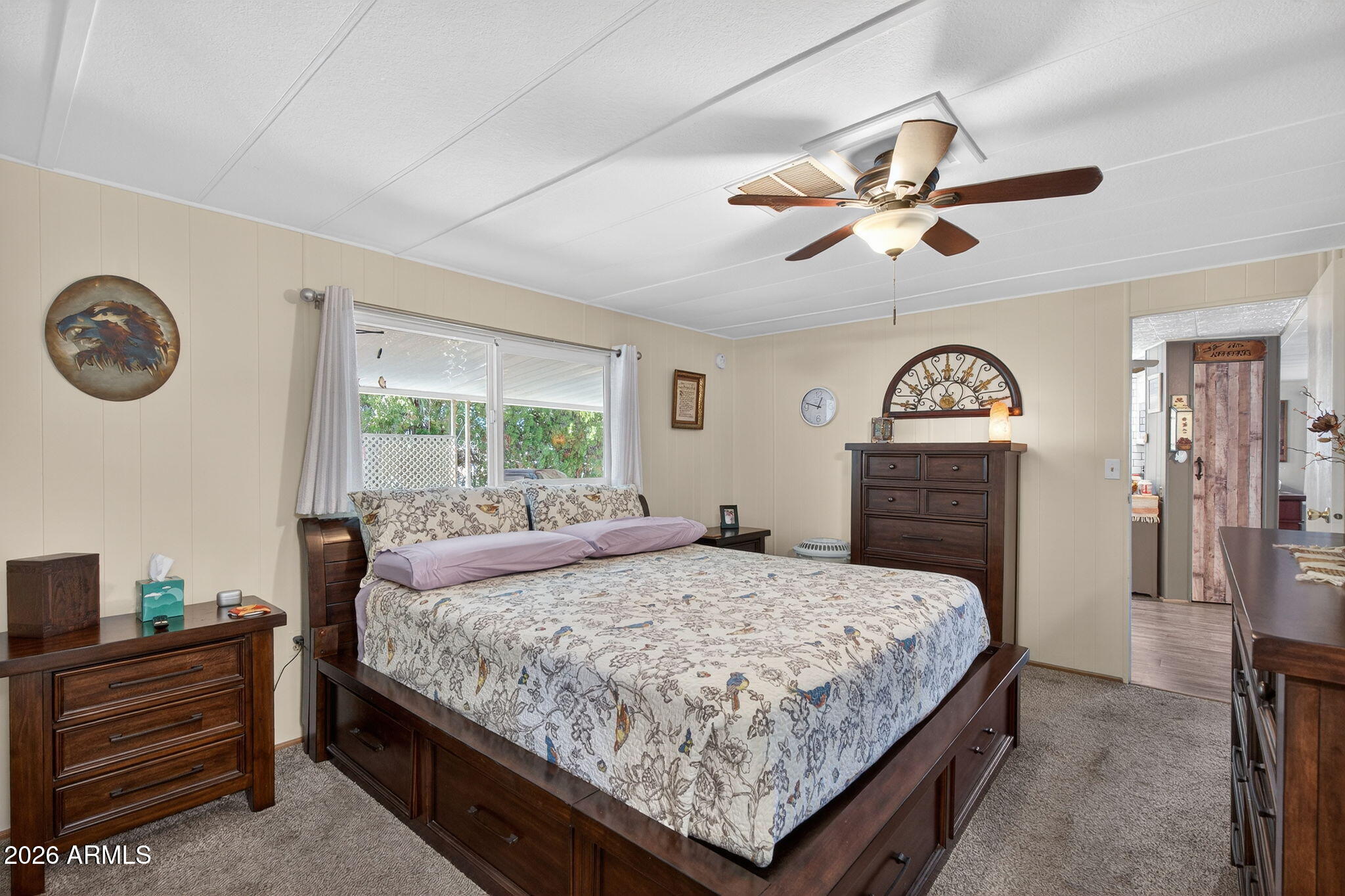 2100 North Trekell Road, Unit 196 Casa Grande, AZ 85122 - Photo 20 of 40 a bedroom with a bed and a chandelier