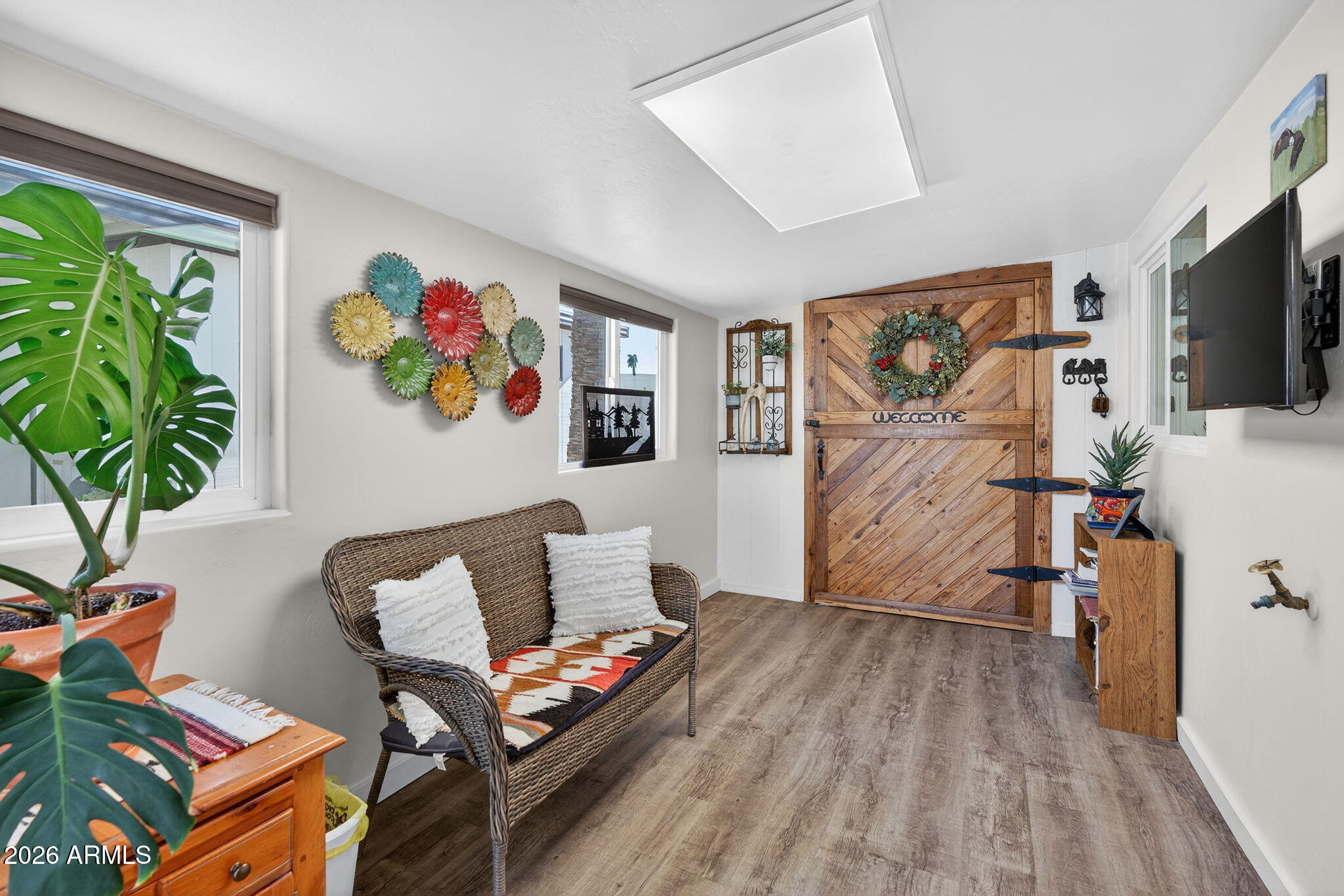 2100 North Trekell Road, Unit 196 Casa Grande, AZ 85122 - Photo 23 of 40 a living room with furniture and a flat screen tv