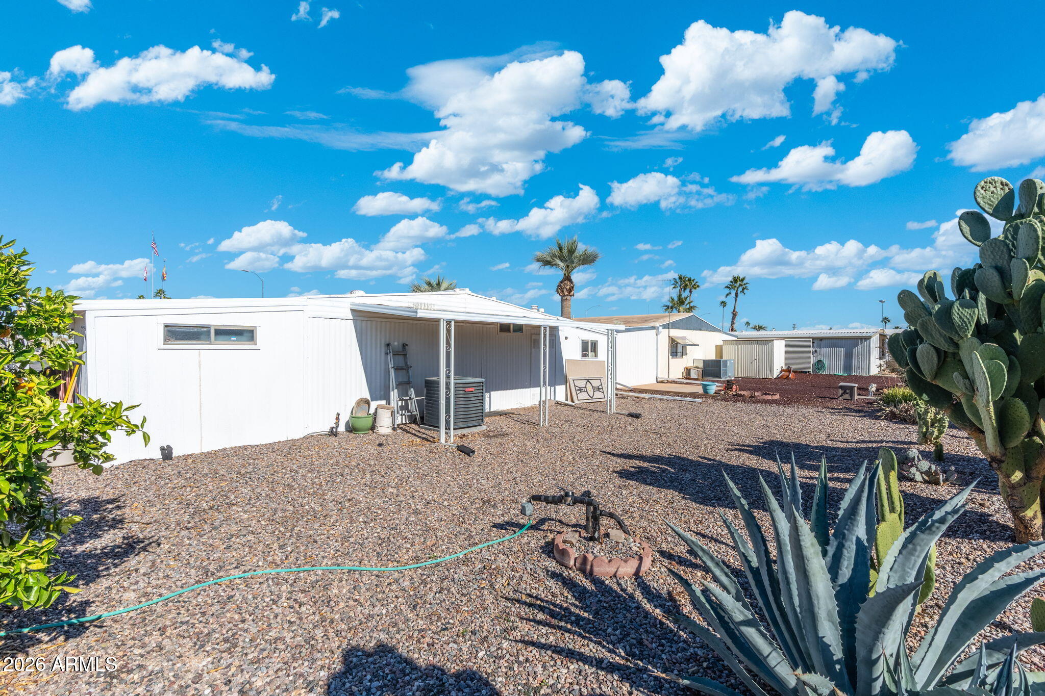 2100 North Trekell Road, Unit 196 Casa Grande, AZ 85122 - Photo 30 of 40 a view of a house with a yard