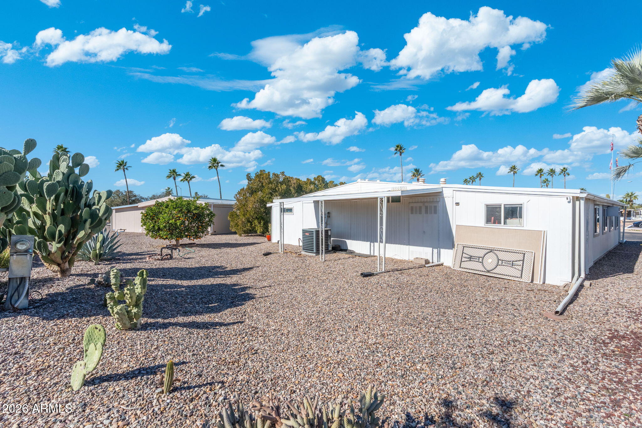 2100 North Trekell Road, Unit 196 Casa Grande, AZ 85122 - Photo 31 of 40 a view of a house with a yard