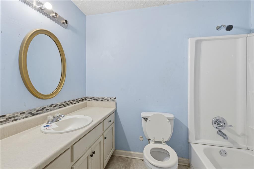 40 Judy Court Stockbridge, GA 30281 - Photo 13 of 20 a bathroom with a toilet sink and mirror