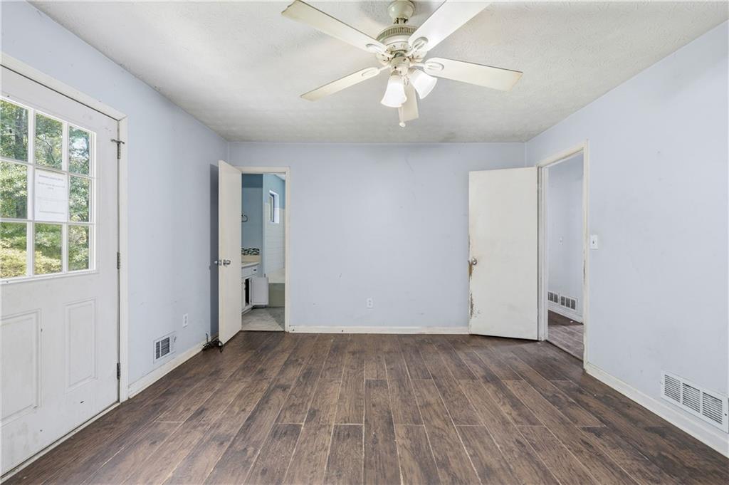 40 Judy Court Stockbridge, GA 30281 - Photo 17 of 20 an empty room with wooden floor and windows