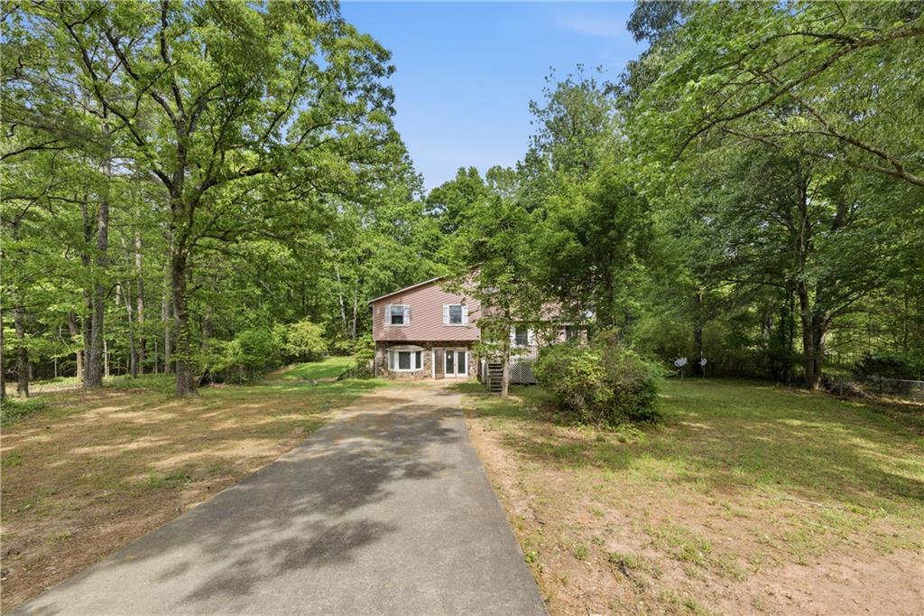 40 Judy Court Stockbridge, GA 30281 - Photo 2 of 20 a sign board with large trees