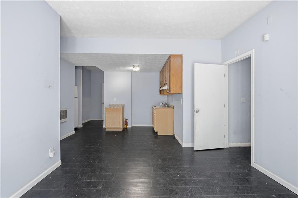 40 Judy Court Stockbridge, GA 30281 - Photo 3 of 20 a view of an empty room with wooden floor and a bathroom